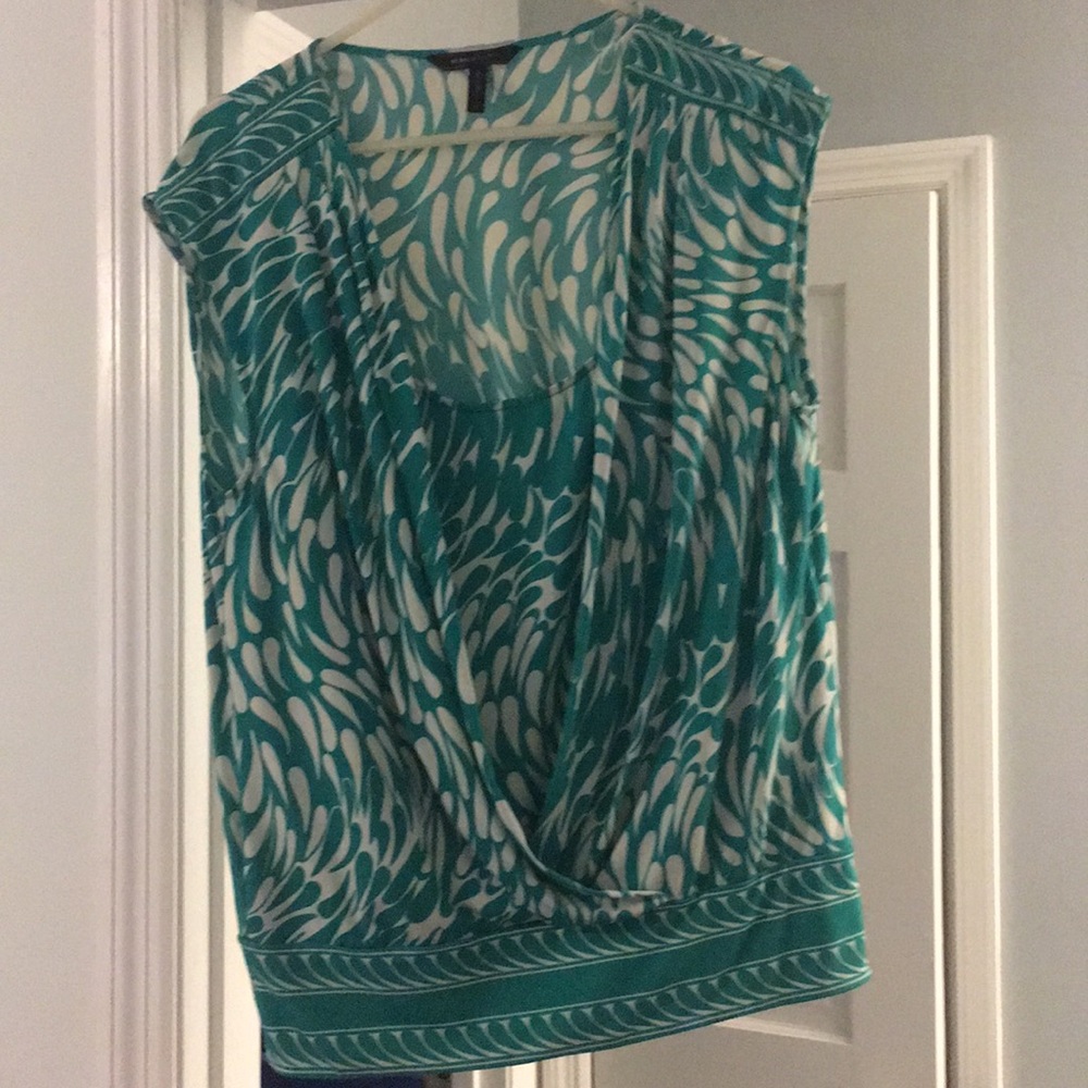 Sleeveless green and white top